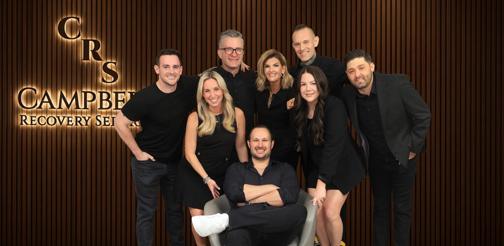 The Campbell Recovery Services team photographed together at their Dallas office